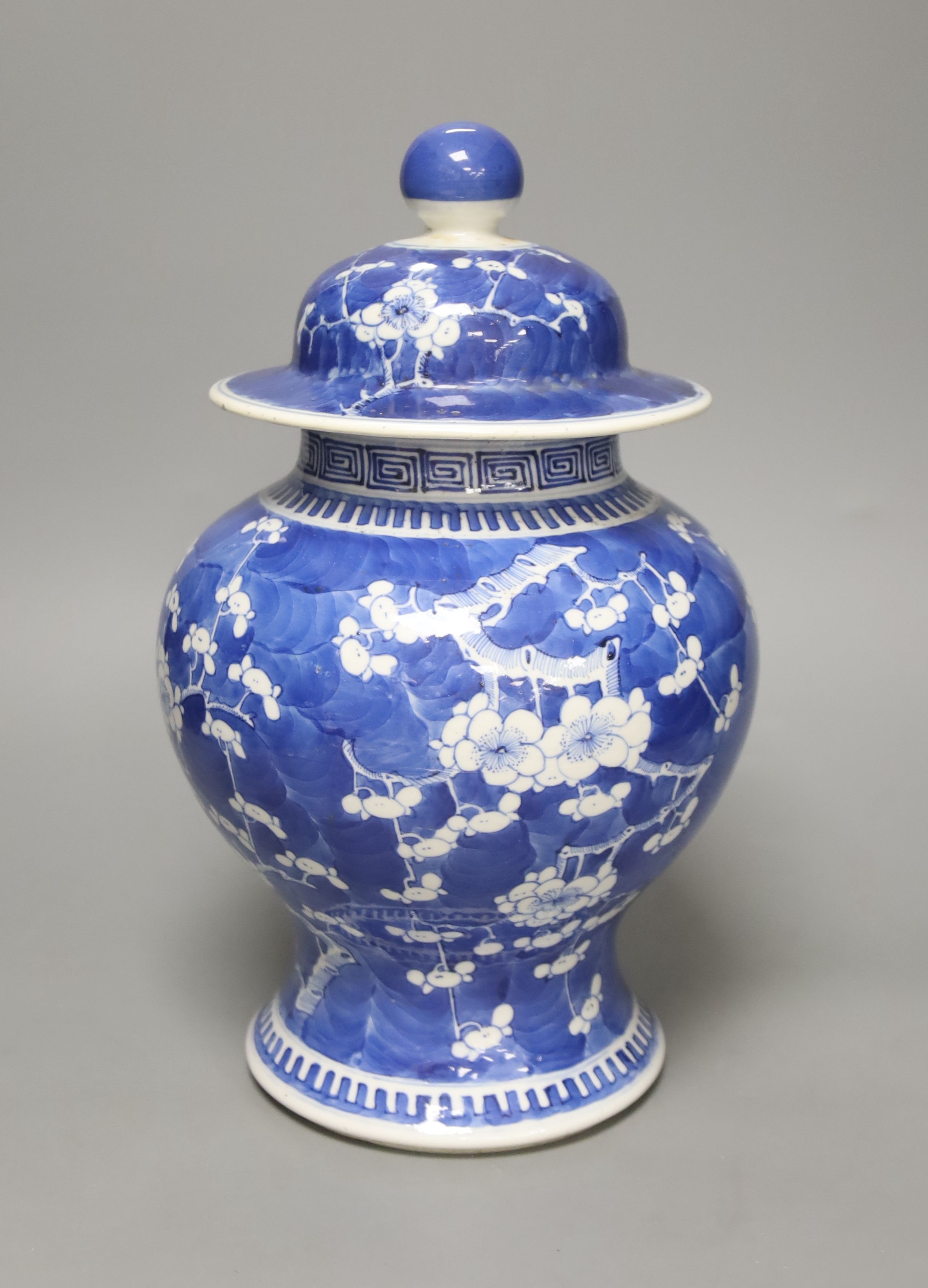 A 19th century Chinese blue and white prunus jar and cover, height, 33cm